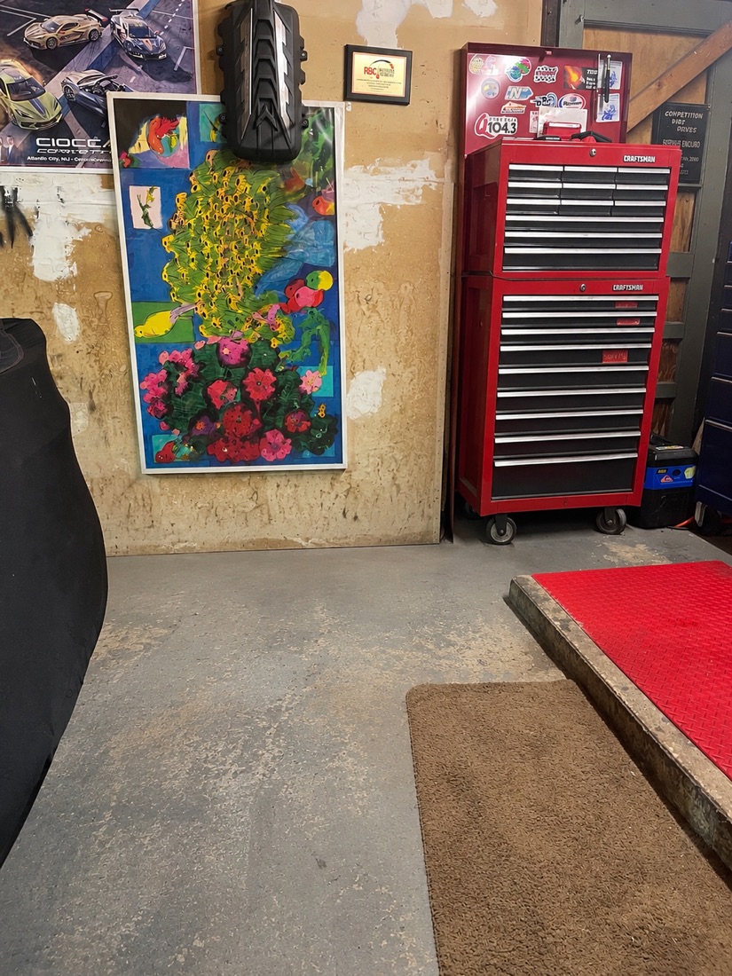 After garage cleanout in Monroe, NJ: the same garage cleared with an open, swept floor